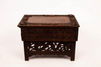 Appraisal: A Tibetan carved prayer table with hinged top label for