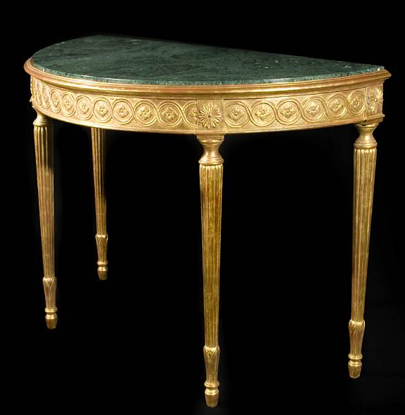 Appraisal: A George III style gilt demilune table With guilloche frieze