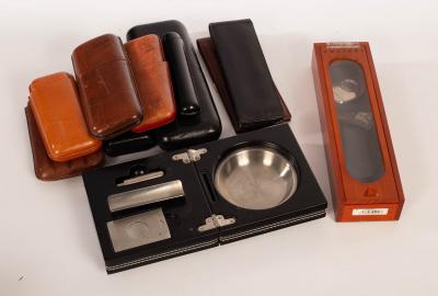 Appraisal: A collection of cigar paraphernalia to include a brown leather