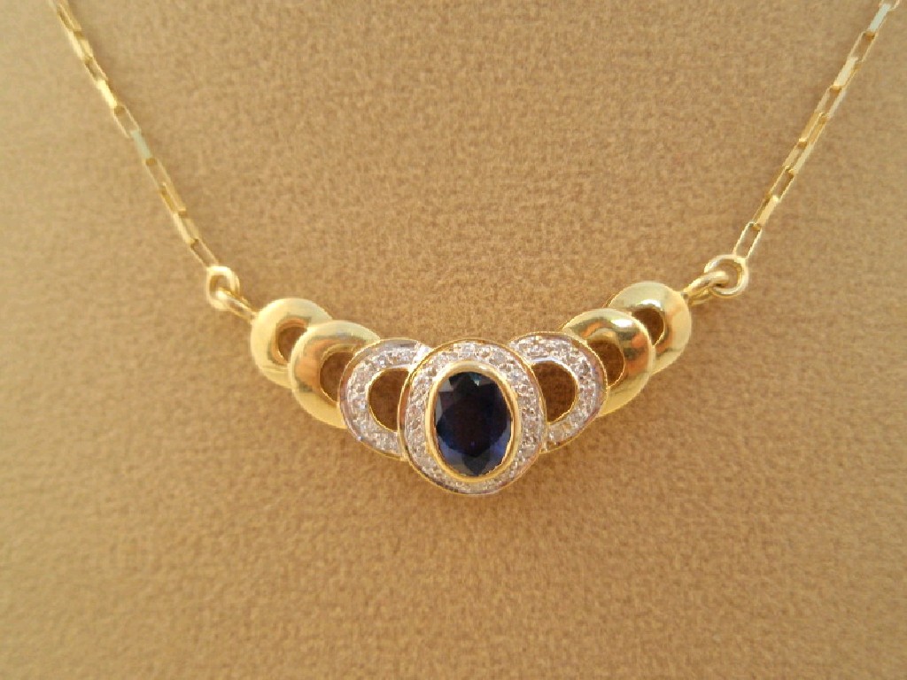 Appraisal: A blue stone and diamond set necklace in yellow metal