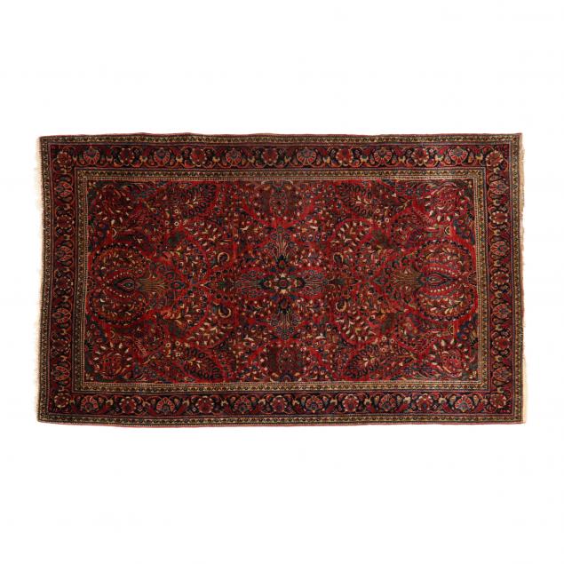 Appraisal: SAROUK AREA RUG Red field with floral sprays and foliate