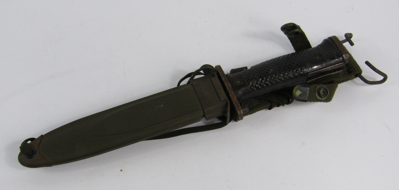 Appraisal: A US bayonet with a black plastic grip metal scabbard