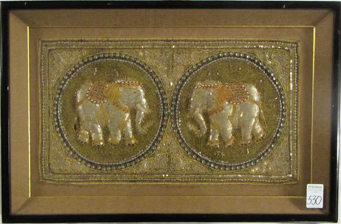 Appraisal: FRAMED INDIAN NEEDLEWORK TAPESTRY WITH ELEPHANTS sewn with silver metallic