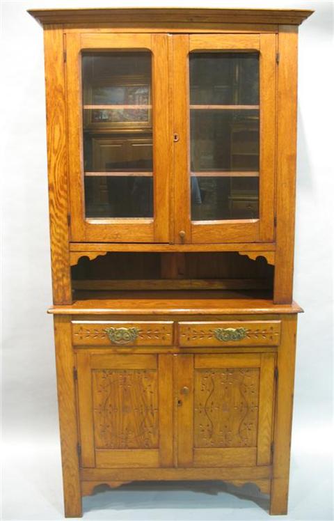 Appraisal: EASTLAKE STYLE OAK HUTCH The molded cornice above pair of