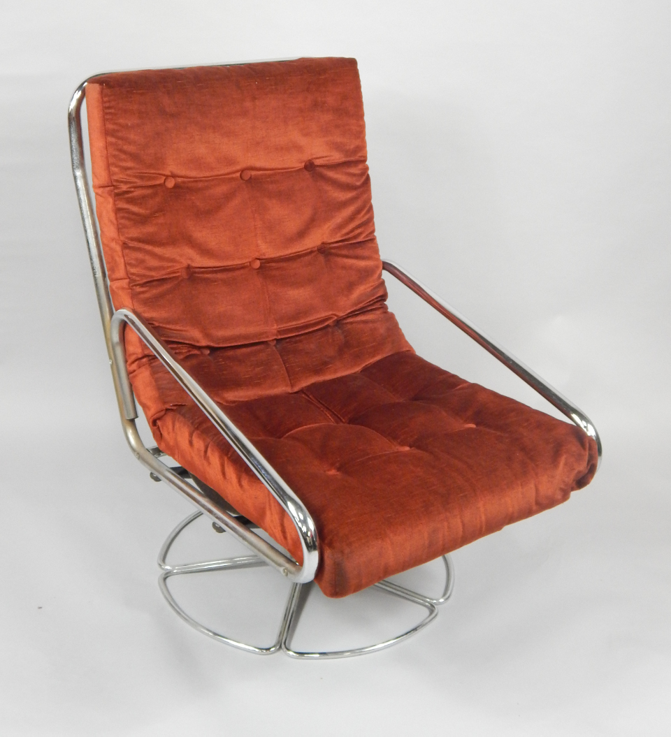 Appraisal: A Danish 's tubular steel swivel armchair with a webbing