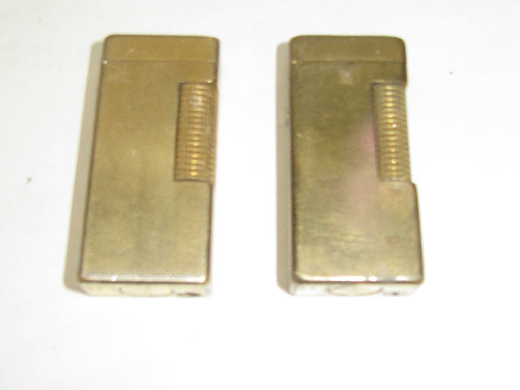 Appraisal: Lot comprising two gilt metal Dunhill cigarette lighters