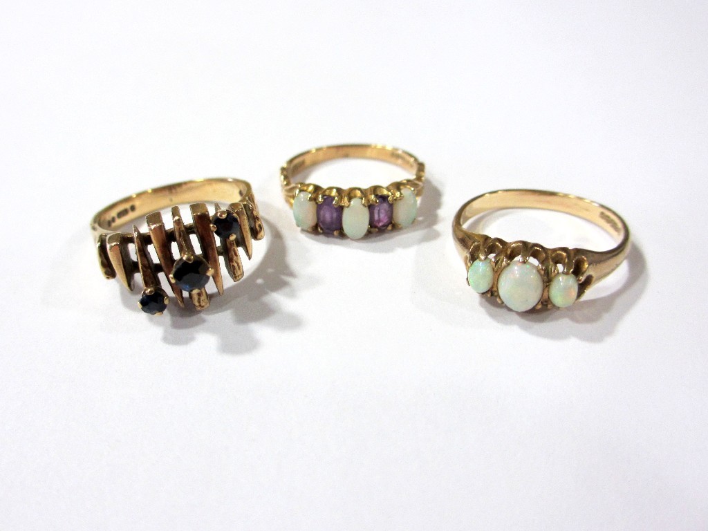 Appraisal: Three gold gem dress rings set with opals amethysts and