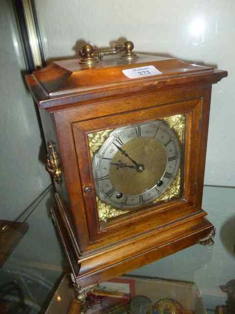 Appraisal: A GEORGIAN STYLE WALNUT CASED BRACKET CLOCK with silvered dial