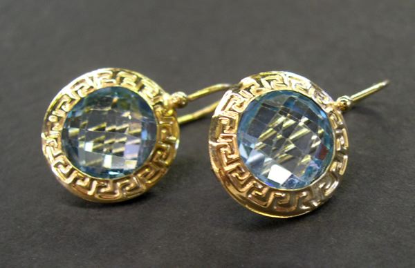 Appraisal: Pair of Fourteen-Karat Yellow Gold and Blue Topaz Earrings containing