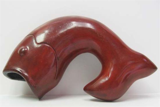 Appraisal: A Chinese Red Lacquer Fish possibly of the Yuan-Ming Dynasty