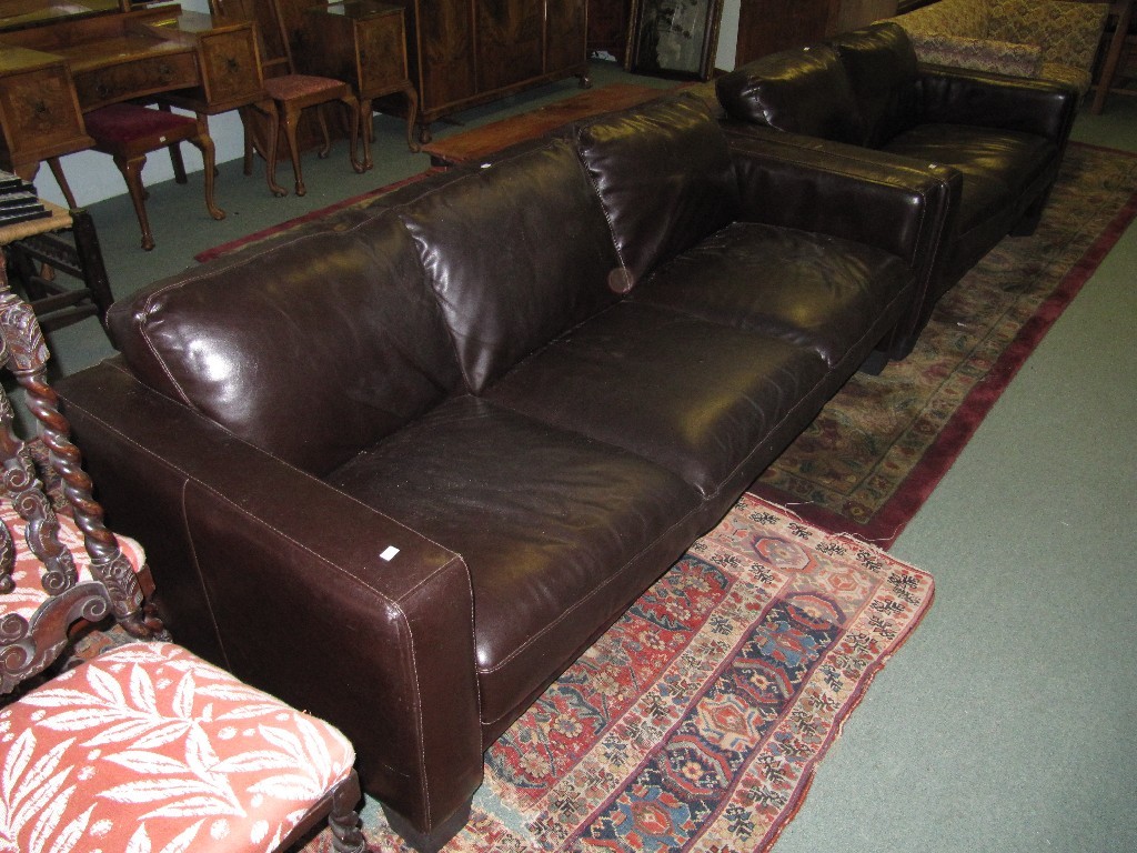 Appraisal: Leather upholstered three seater settee with matching two seater settee