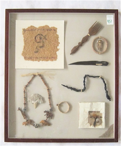 Appraisal: FRAMED COLLAGE OF AFRICAN OBJECTS such as fettish necklace bracelet