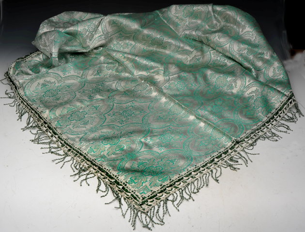 Appraisal: A SYRIAN PALE GREEN AND SILVER THREAD TABLE COVER with