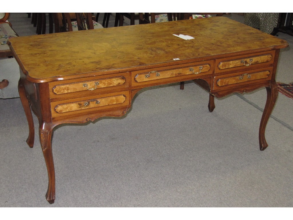 Appraisal: walnut kneehole desk raised on cabriole supports