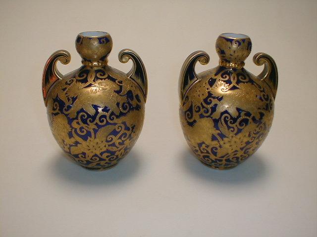 Appraisal: A pair of Derby porcelain ovoid vases with cup shape