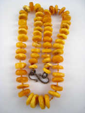 Appraisal: An amber necklace approx cm long beads approx cm wide