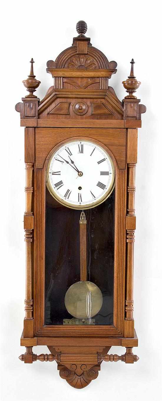 Appraisal: Ansonia walnut wall clock late th century rectangular case with