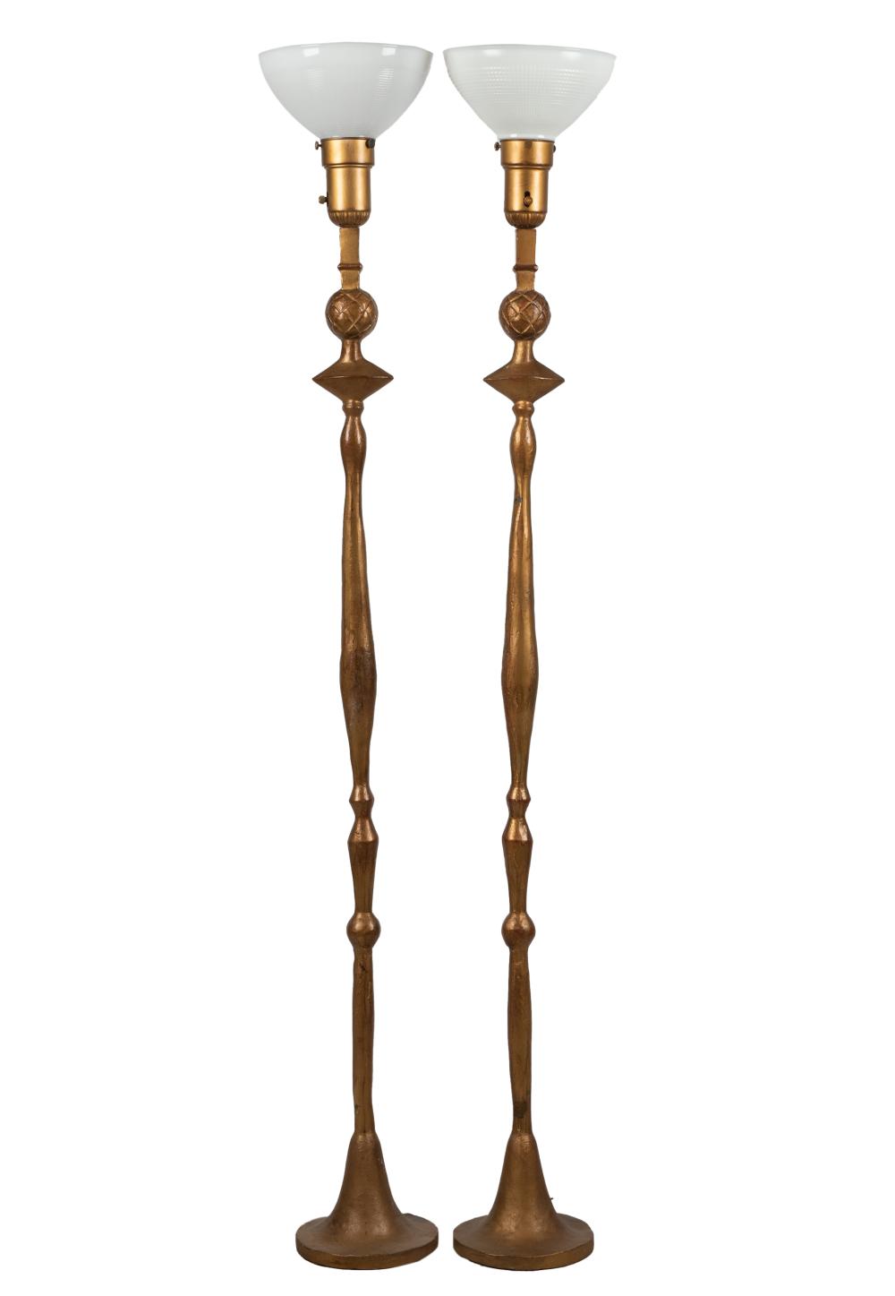 Appraisal: AFTER GIACOMETTI PAIR TETE DE FEMME FLOOR LAMPSgilt bronze with