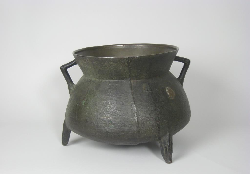 Appraisal: A th Century bronze Cauldron with triangular handles on three