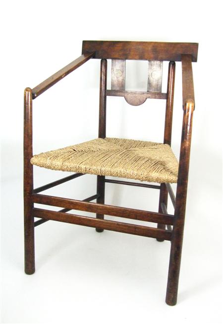 Appraisal: WYLIE LOCHHEAD GLASGOW BEECH ARMCHAIR CIRCA the rectangular top rail