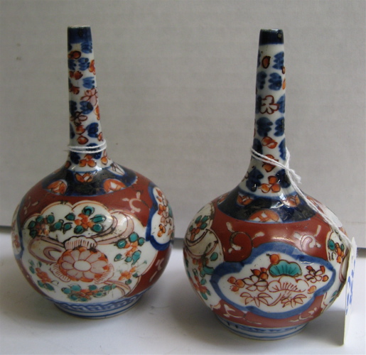 Appraisal: PAIR JAPANESE IMARI PORCELAIN BUD VASES early Meiji Period Hand