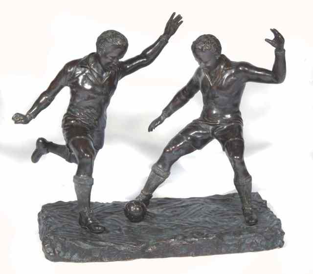 Appraisal: TIENNE FORESTIER TH TH CENTURY Footballers Sculpture signed to the