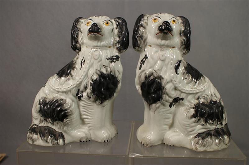 Appraisal: Pr Staffordshire white spaniels black trim and gold collar and