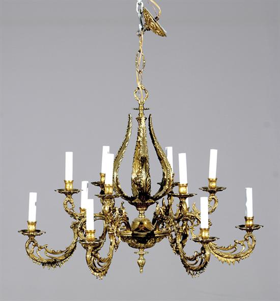 Appraisal: Bronze twelve-light chandelier central stem issuing scrolling arms terminating in