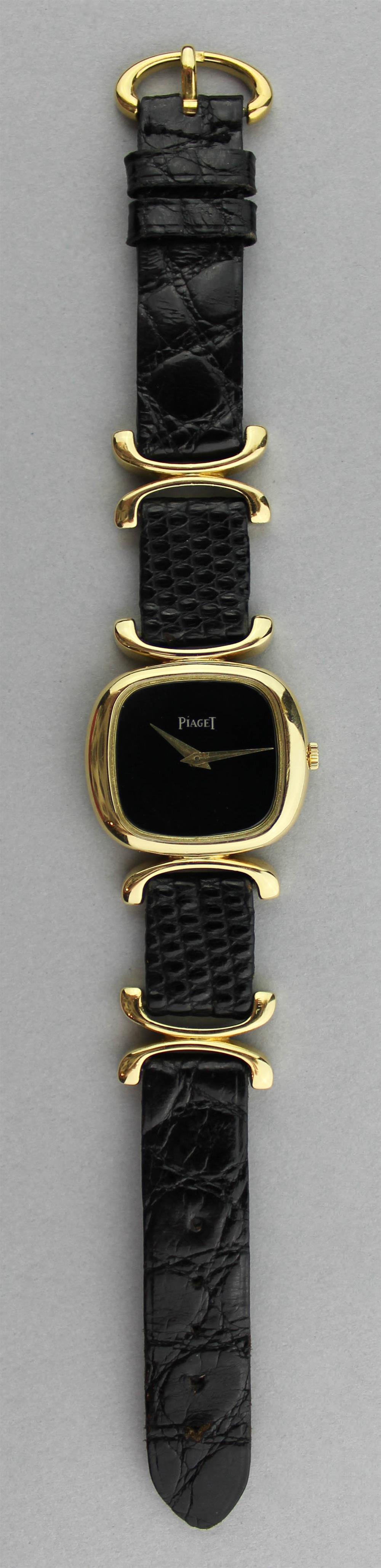 Appraisal: K YELLOW GOLD MECHANICAL PIAGET WATCH having a black dial