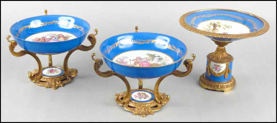 Appraisal: PAIR OF LIMOGES PORCELAIN COMPOTES Together with a matching taller