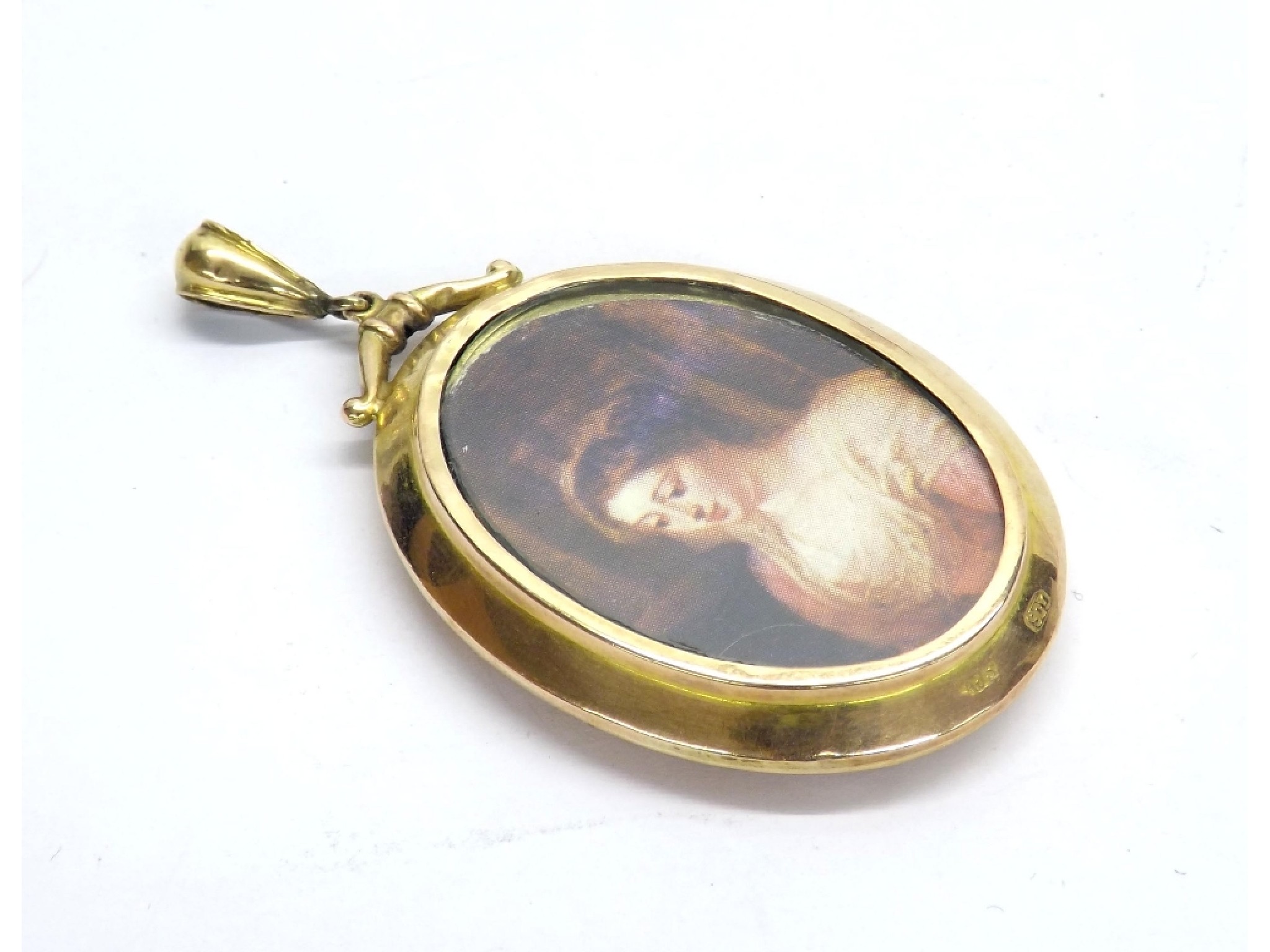 Appraisal: ct yellow gold oval locket pendant inset with modern printed