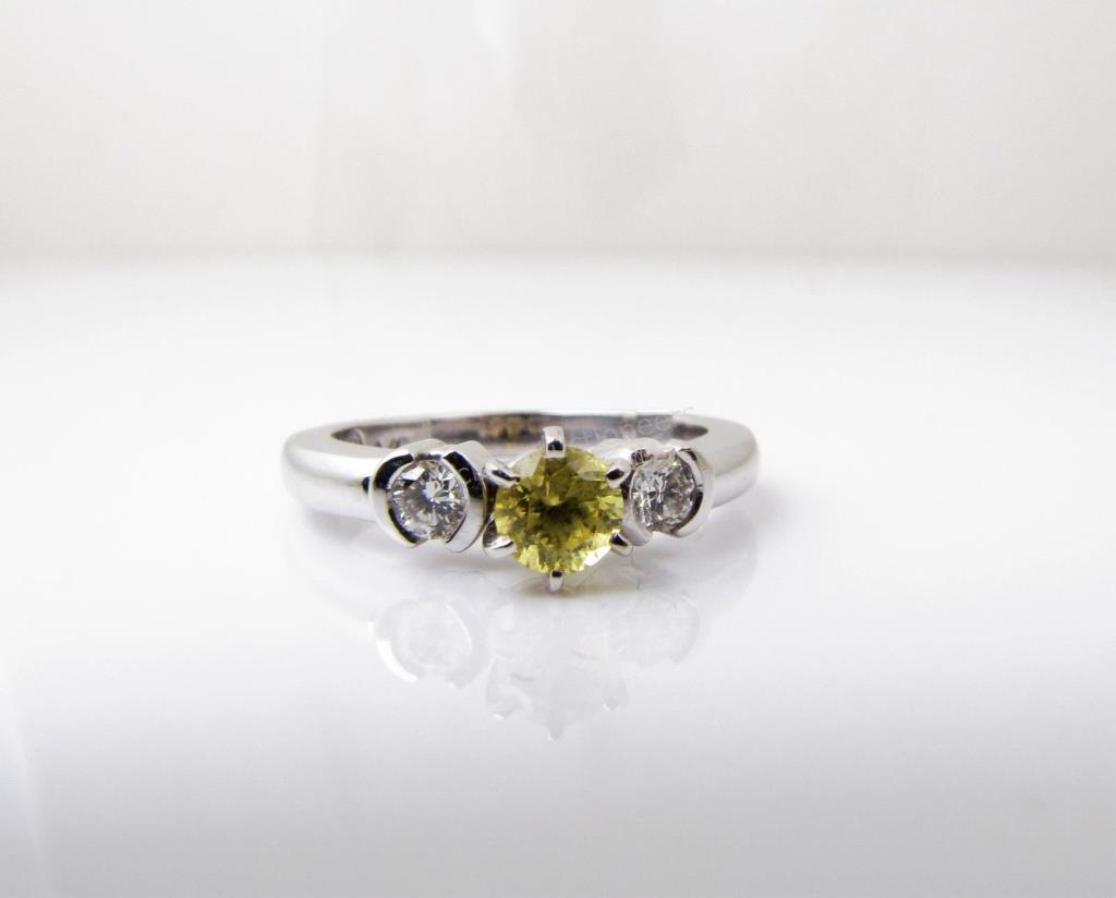 Appraisal: A K white gold three stone ring with a ct