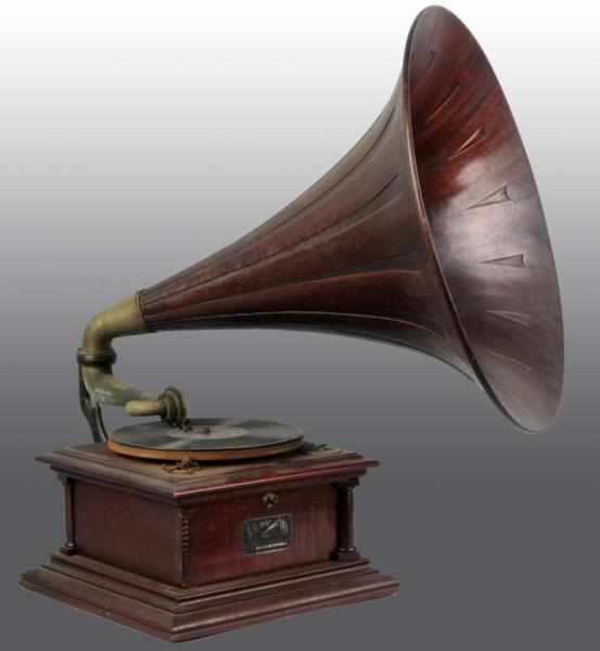 Appraisal: Victor Talking Machine with Large Wooden Horn Description Working Rust