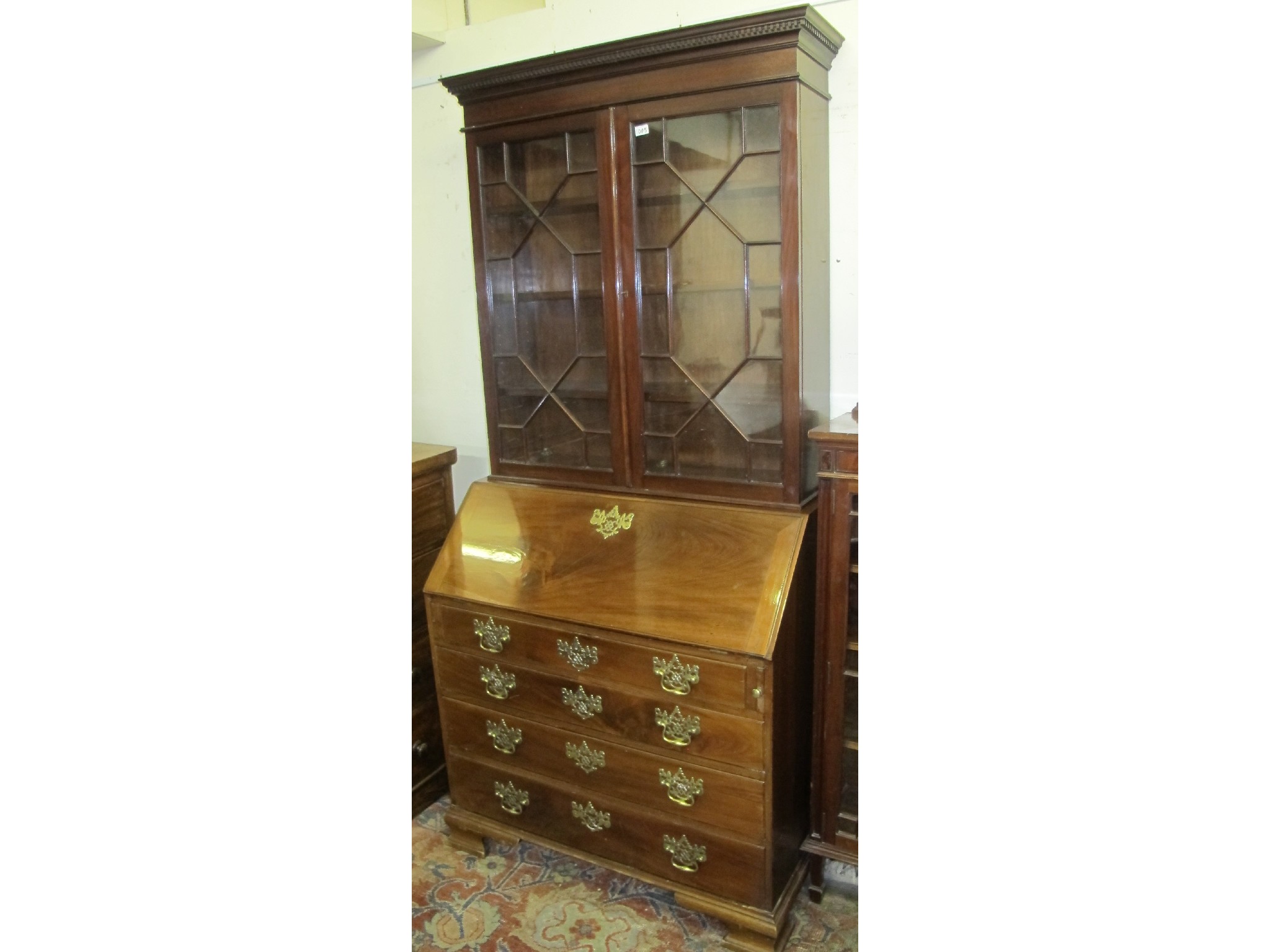 Appraisal: A mahogany George III style bureau and a bookcase top