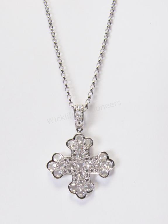 Appraisal: An K white gold cross pendant with ct of fine