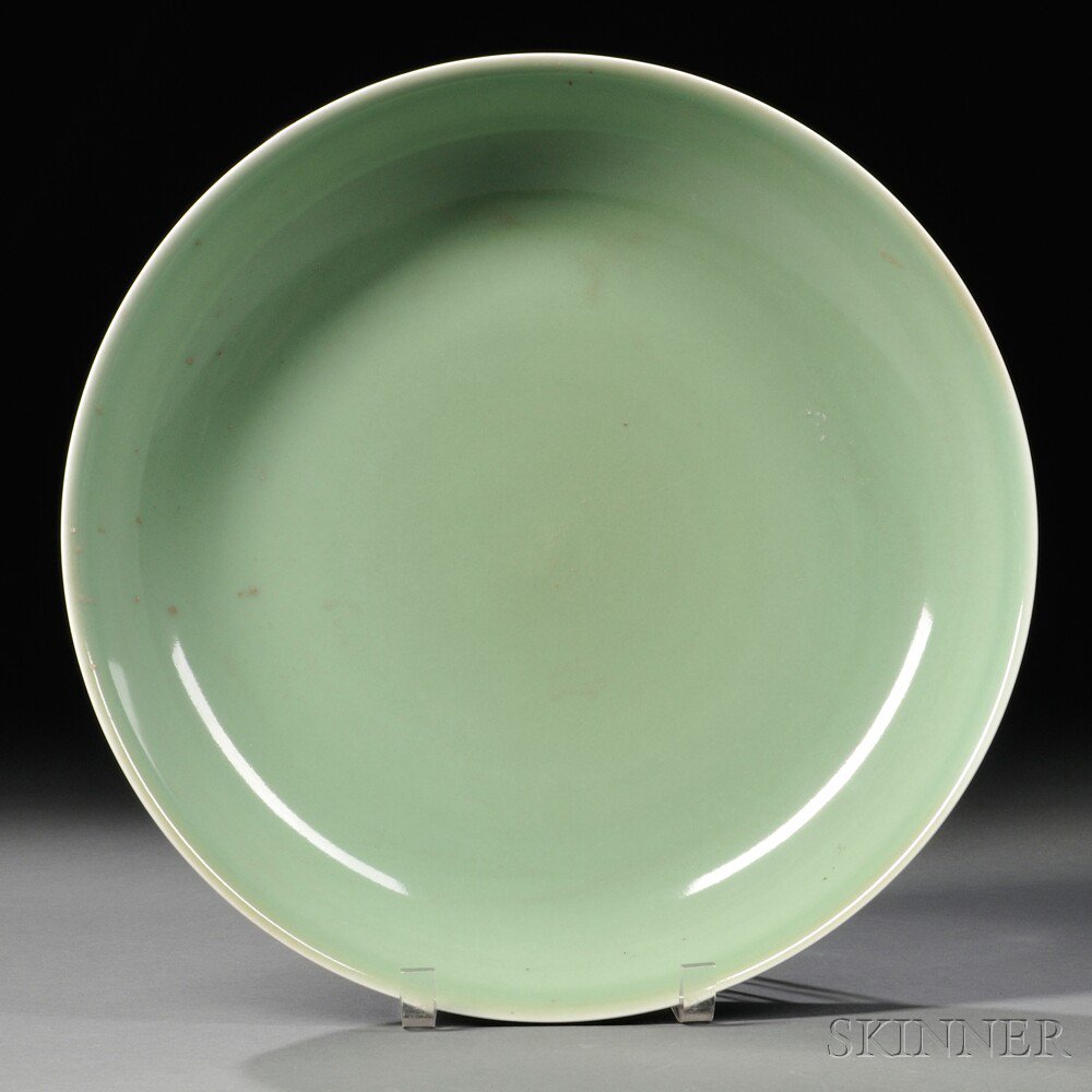 Appraisal: Plain Green-glazed Charger China the gradually flared wall with a