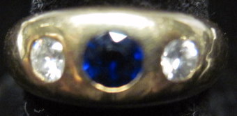 Appraisal: karat yellow gold diamond and sapphire ringGypsy mounted round cut