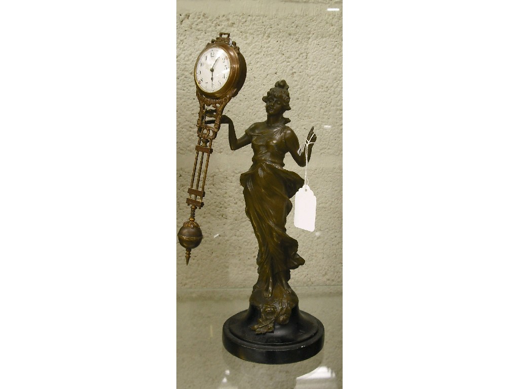 Appraisal: Swinging Diana spelter mystery clock with dial supported upon a