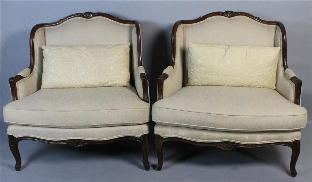 Appraisal: PAIR OF LOUIS XV STYLE OVERSIZED ARMCHAIRS the tight back