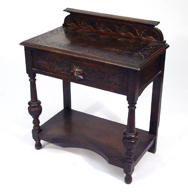 Appraisal: s oak hall table with carved frieze and top and