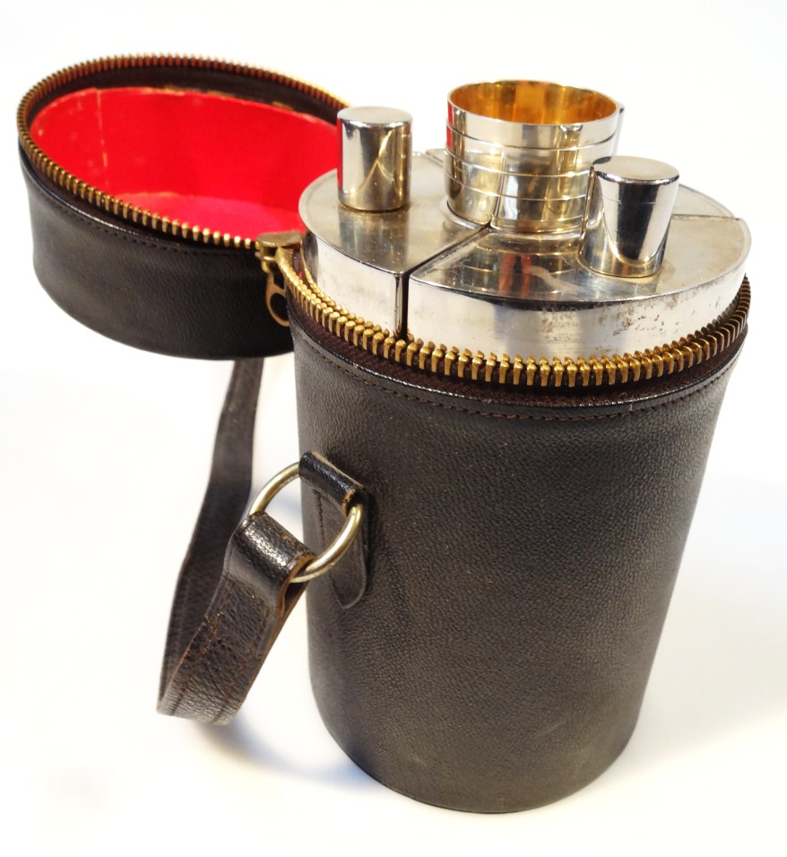 Appraisal: A thC chrome plated travelling decanter set in a cylindrical