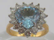 Appraisal: A yellow metal tests carat gold aquamarine and diamond ring