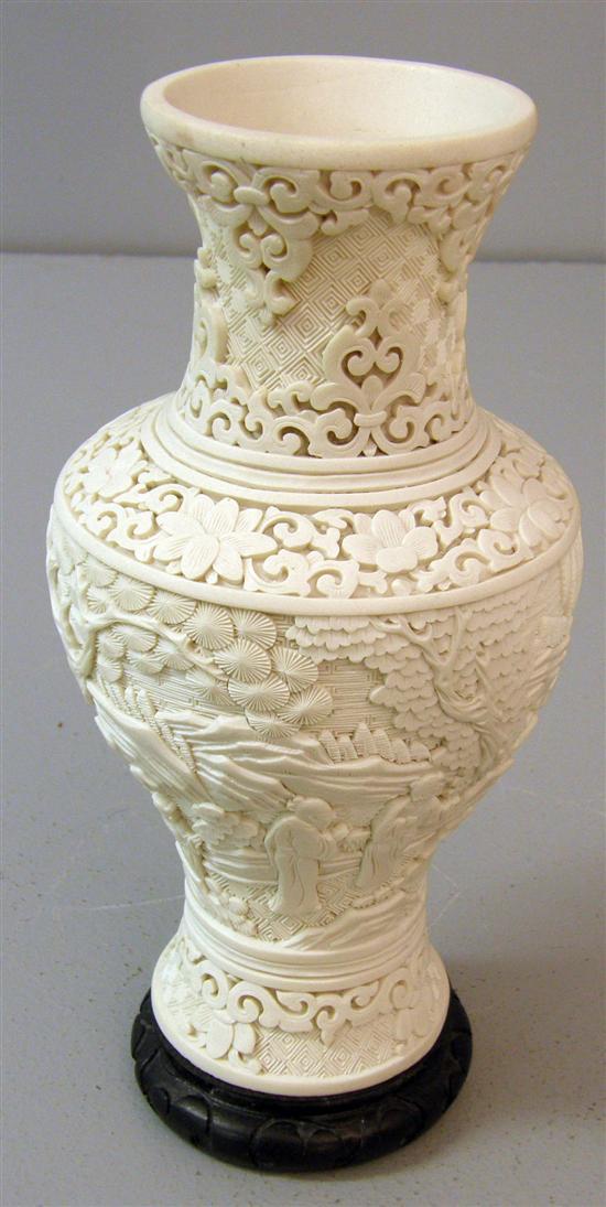 Appraisal: Chinese intricately carved stone vase decorated with figures in gardens