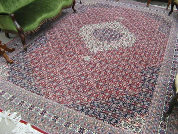 Appraisal: HAND KNOTTED ORIENTAL CARPET Sino-Persian overall floral design across all