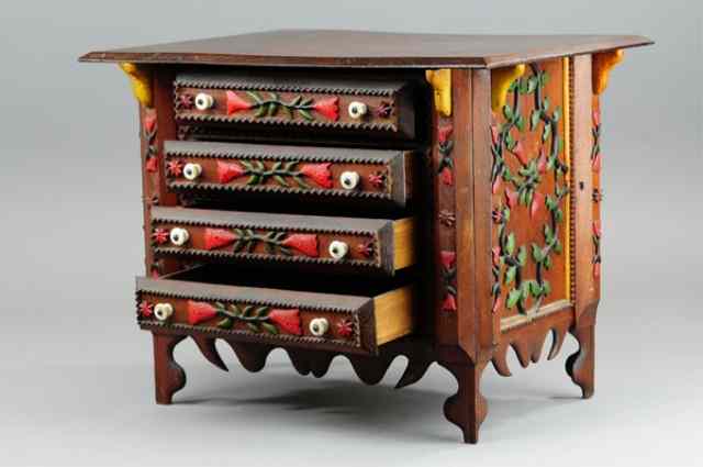 Appraisal: CHILD'S TRAMP ART CHEST Intricate wood carving accents on sides