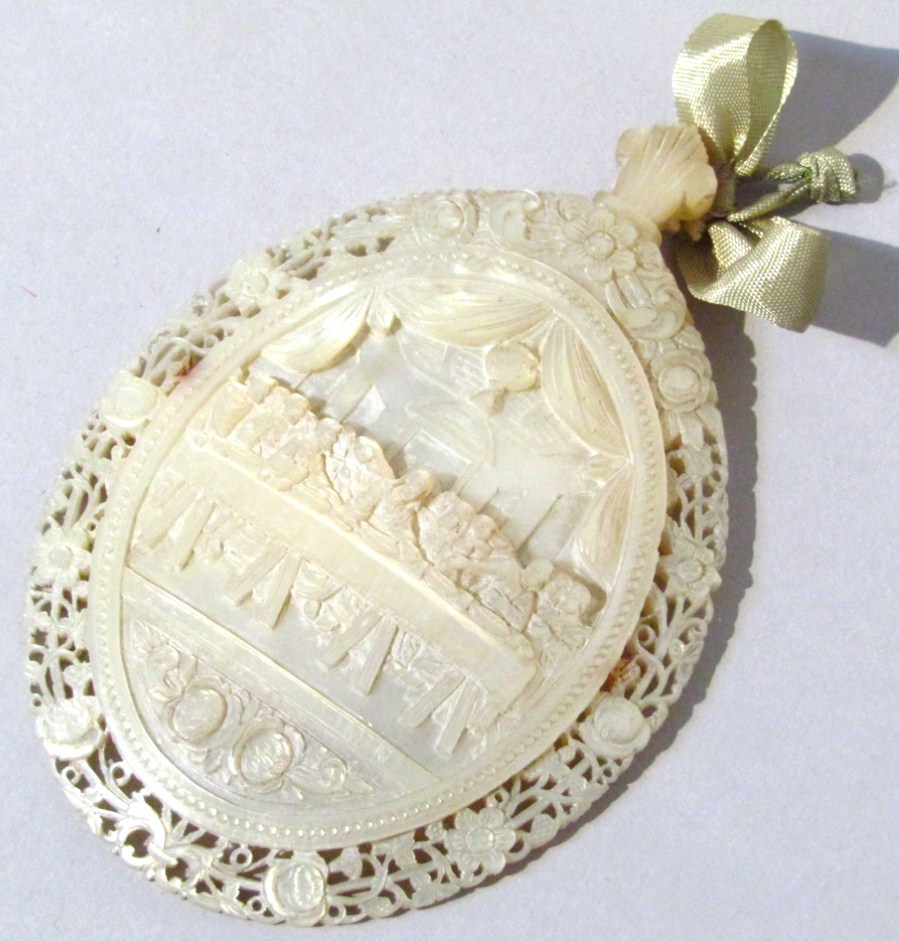 Appraisal: A thC nacre mother of pearl carved shell of oval