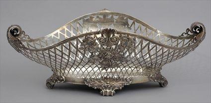 Appraisal: SILVER CENTERPIECE Marked Sterling the pierced lattice boat-form bowl with