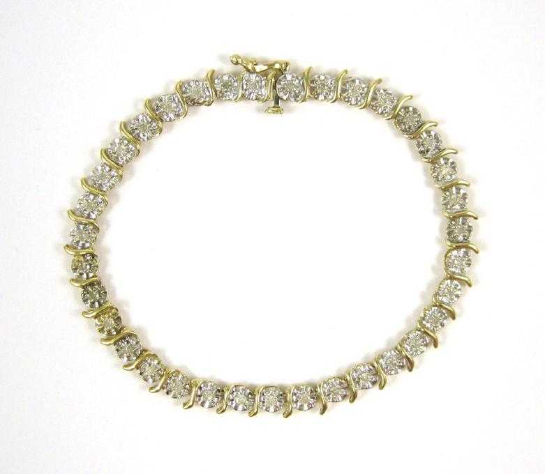 Appraisal: DIAMOND AND TEN KARAT GOLD BRACELET The yellow and white