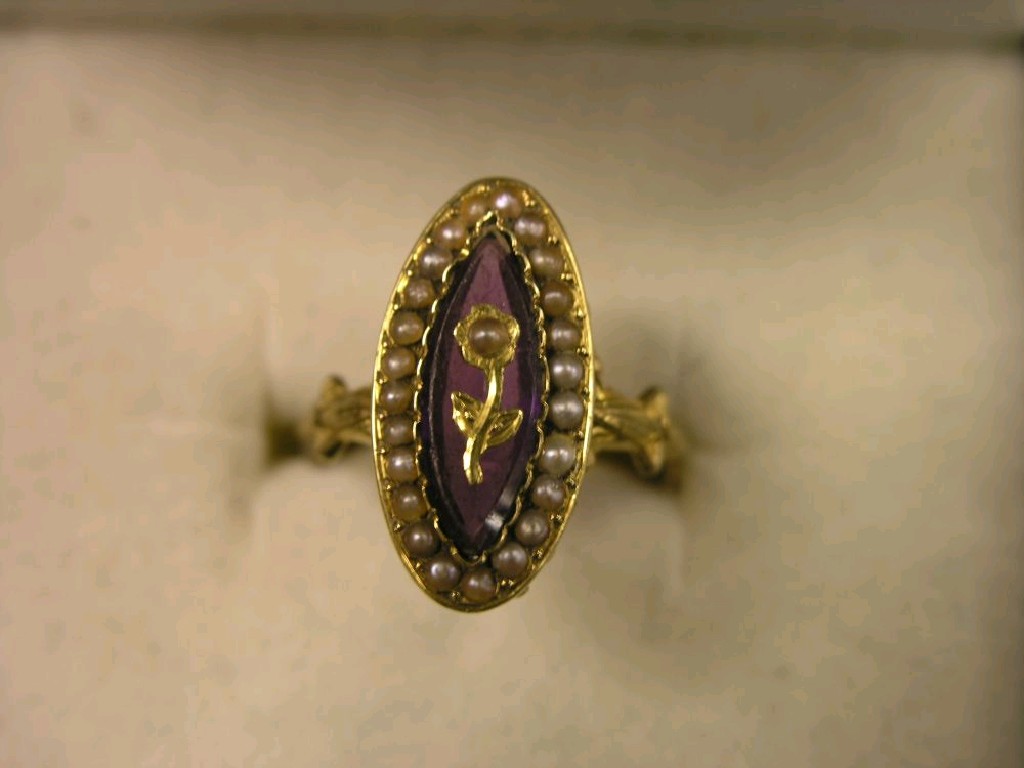 Appraisal: A Victorian amethyst and seed pearl ring lozenge-shape with inset