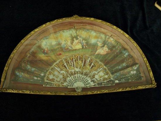 Appraisal: A th Century fan the paper leaf decoration on one